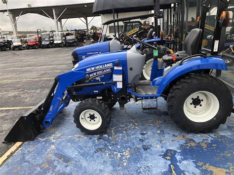 New Holland Agriculture Boomer 24 logo