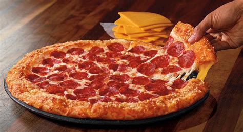 Pizza Hut Triple-Cheese Covered Stuffed Crust Pizza logo