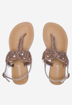 ShoeDazzle Terena Flat Sandal logo